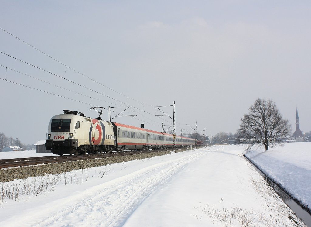 1116 264  �3 Hitradio  mit einem Korridorzug von Salzburg nach Innsbruck unterwegs. Aufgenommen am 24. Februar 2013  bei �bersee am Chiemsee.