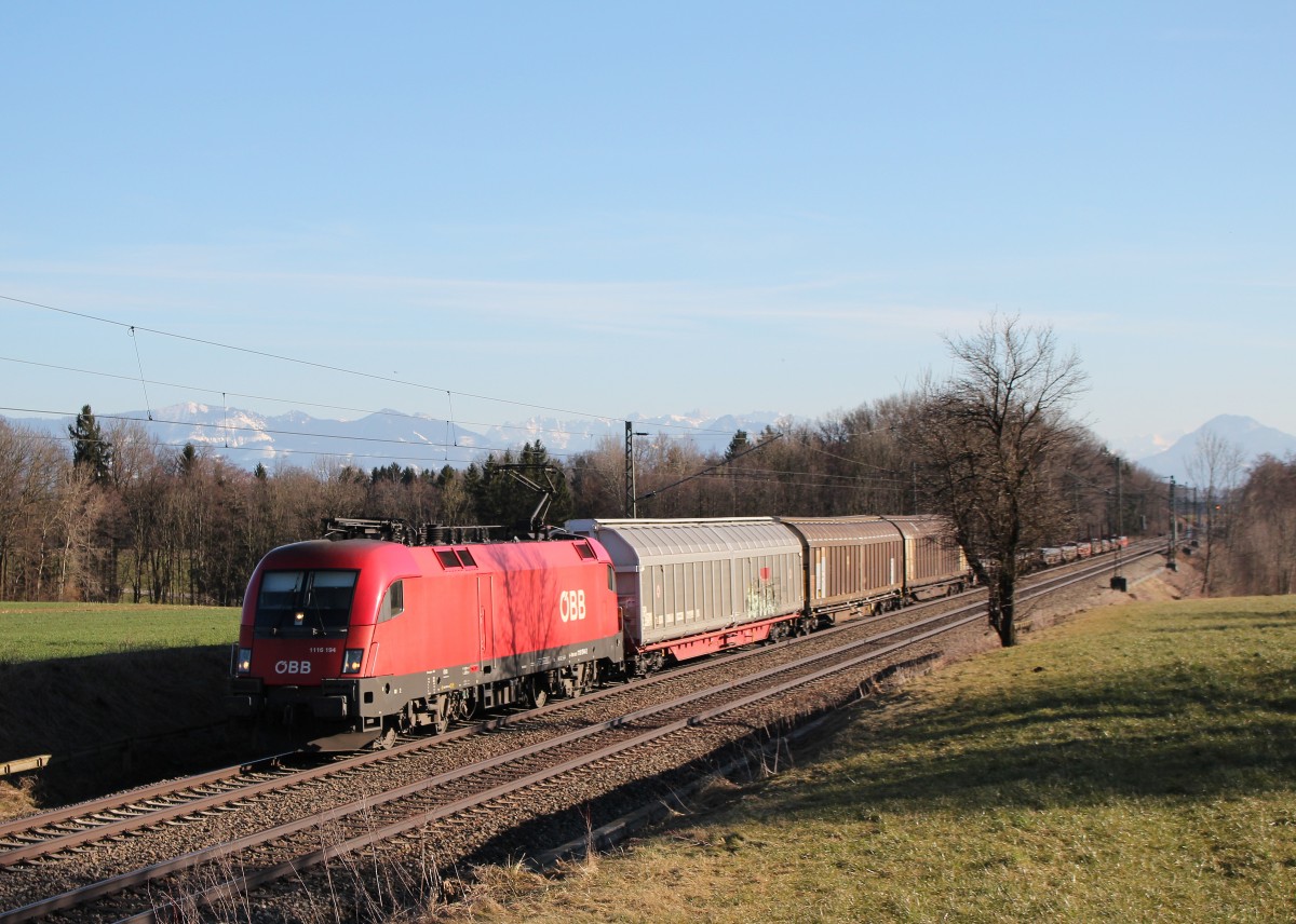 1116 194-2 mit einem gemischten G�terzug am 7. M�rz 2015 bei Hilperting.