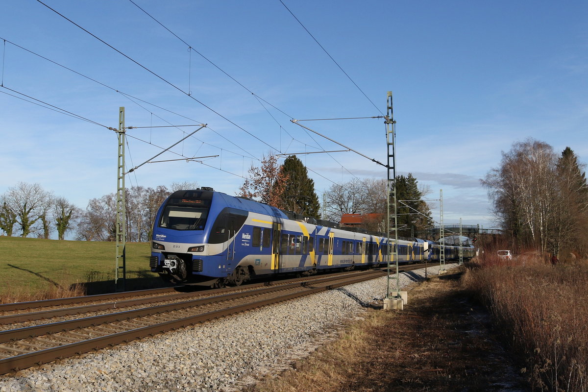 ET 313 war am 30. Dezember 2019 bei Grabenst�tt in Richtung M�nchen unterwegs.